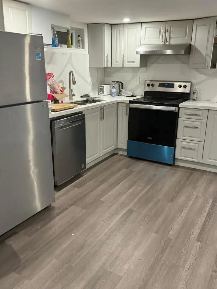 Kitchen with stainless appliances and white cabinets