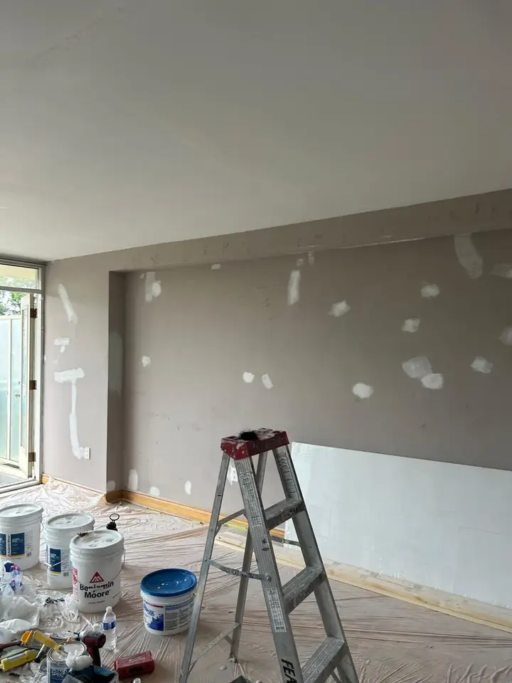 Room prepped with buckets and ladder