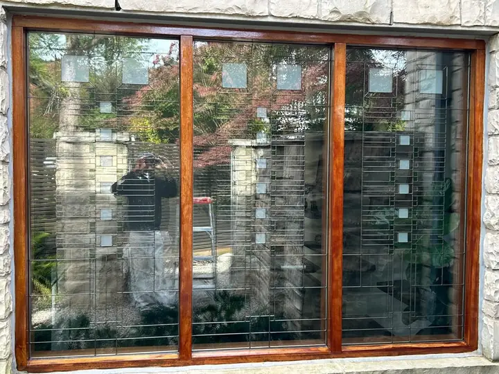 Wood window frame with stained glass