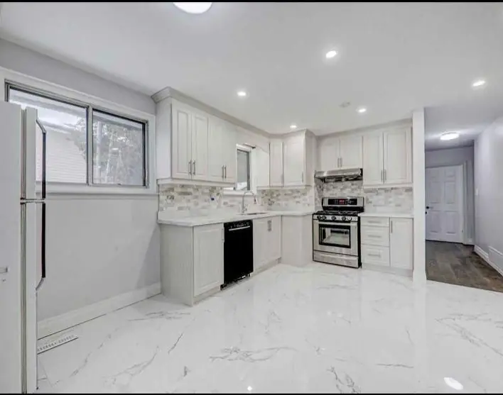 White kitchen with marble floor