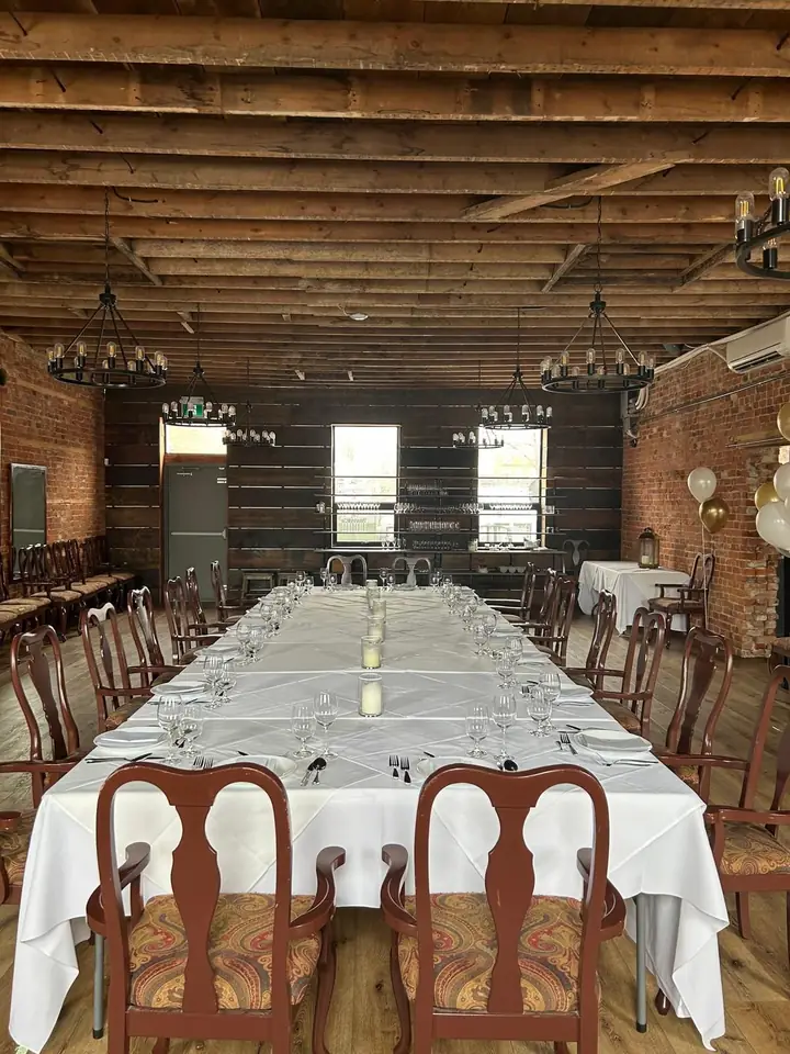 Long tables set in the finished hall